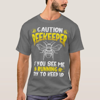 Camiseta Precaución Si Me Ves Corriendo Intenta Seguir Arri