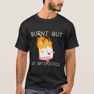 Camiseta Quemados, pero optimistas diciendo una cita de hum