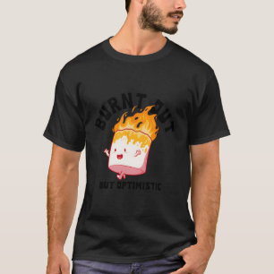 Camiseta Quemados, pero optimistas diciendo una cita de hum