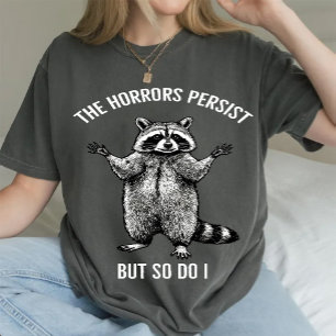 Camiseta Raccoon Los Horrores Persisten Pero Yo También