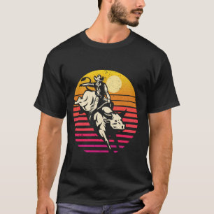 Camiseta Rodeo de vaquero montando toro al atardecer