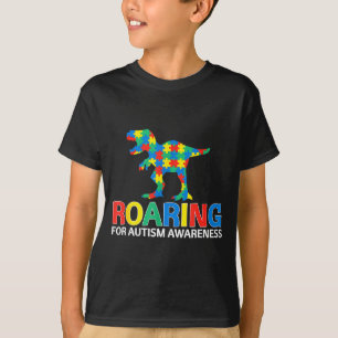 Camiseta Rugiendo por la conciencia del autismo chicos dino