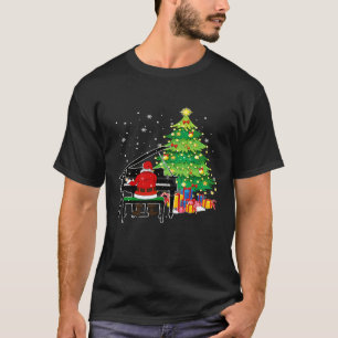 Camiseta Santa Claus juega al piano cerca del árbol de Navi