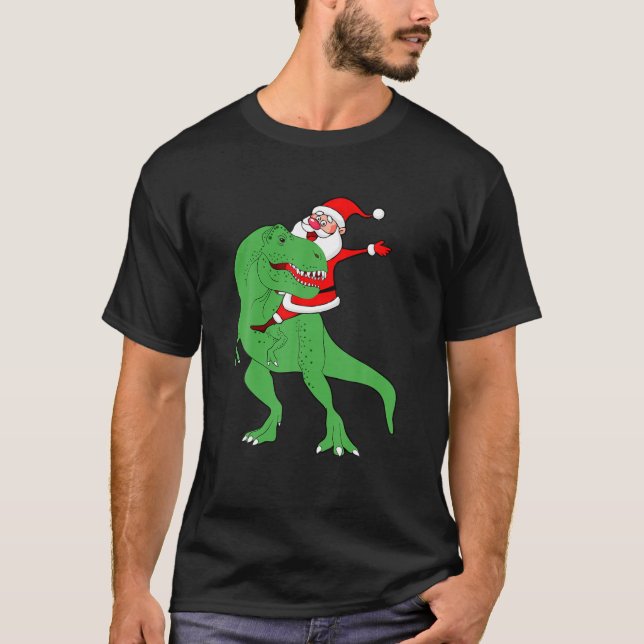 Camiseta Santa Claus montando dinosaurio en Navidades diver (Anverso)