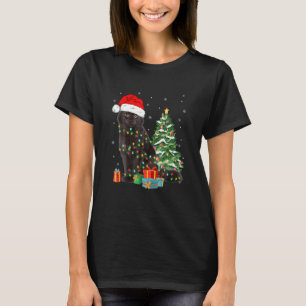 Camiseta Santa de gato negro en ángulo en luces de Navidad 