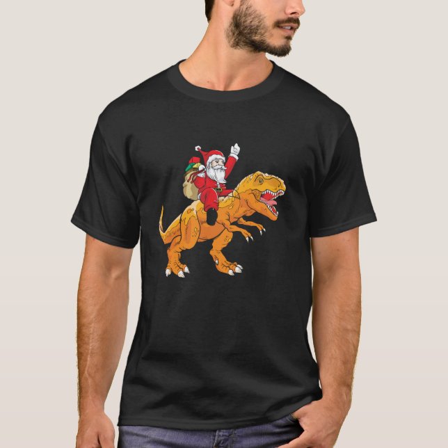 Camiseta Santa Riding Trex Navidades de dinosaurios niños d (Anverso)
