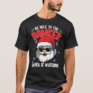 Camiseta Sé Agradable Con El Banquero Que Santa Está Viendo