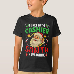 Camiseta Sé Agradable Con El Cashier Santa Está Viendo Navi