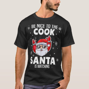 Camiseta Sé Agradable Con El Cocinero Santa Viendo A Los Na