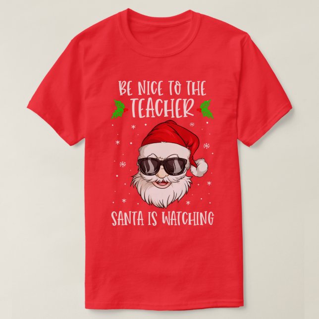 Camiseta Sé Agradable Con El Profesor Santa Está Viendo Al  (Diseño del anverso)