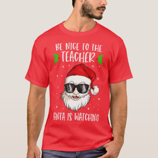 Camiseta Sé Agradable Con El Profesor Santa Está Viendo Al