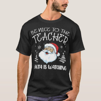 Camiseta Sé Agradable Con El Profesor Santa Está Viendo Al