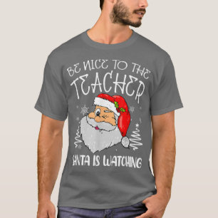 Camiseta Sé Agradable Con El Profesor Santa Está Viendo El