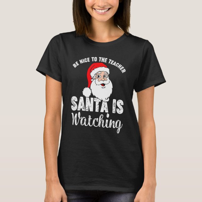 Camiseta Sé Agradable Con El Profesor Santa Está Viendo La  (Anverso)
