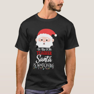 Camiseta Sé Agradable Con El Profesor Santa Está Viendo La