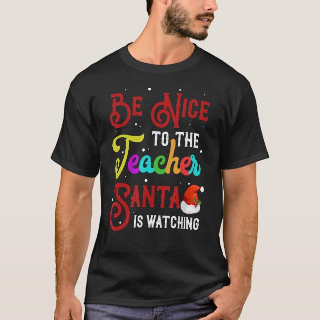 Camiseta Sé Agradable Con El Profesor Santa Está Viendo Nav (Anverso)