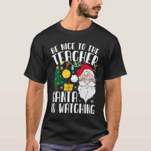 Camiseta Sé Agradable Con El Profesor Santa Está Viendo Nav