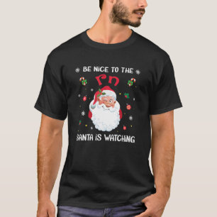 Camiseta Sé Agradable Con El RN Santa Está Viendo A Enferme