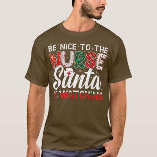 Camiseta Sé Agradable Con La Enfermera Que Santa Está Viend