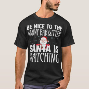 Camiseta Sé Agradable Con La Niñera Que Santa Está Viendo