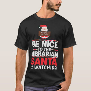 Camiseta Sé amable con el Santa bibliotecario vigilando div