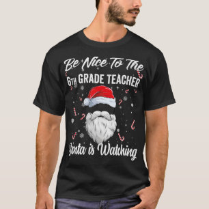 Camiseta Sé bueno con el profesor de sexto grado que Santa 