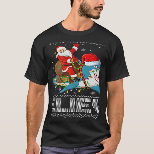 Camiseta Shark Xmas Lighting Believe Ugly Santa Riding Shar (Anverso)