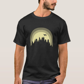 Camiseta Silueta de ciudad con avión edificio niño