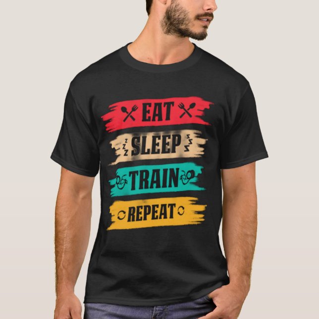 Camiseta Sleep. Train. Repeat. – The Ultimate Fitness Grind (Anverso)