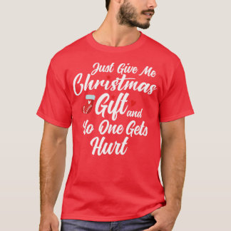 Camiseta solo dame un regalo de navidades y nadie sale heri