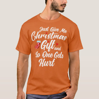 Camiseta solo dame un regalo de navidades y nadie sale heri