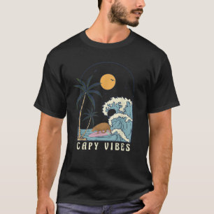 Camiseta Surf de Chigüiro en plena playa del atardecer