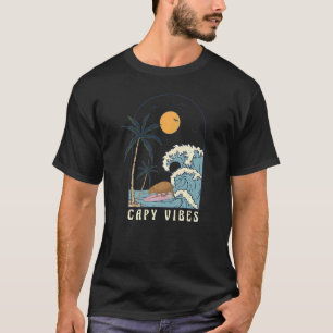 Camiseta Surf de Chigüiro en plena playa del atardecer