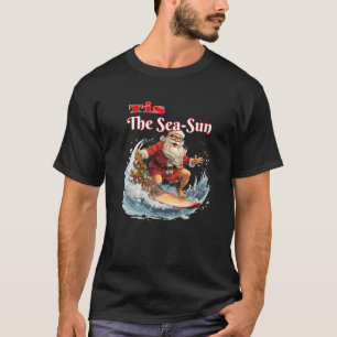 Camiseta Surfing Santa Claus Tis The Sea Sun Premium