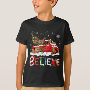 Camiseta T-rex Dinosaur Montando Camión Rojo Feliz Navidad 