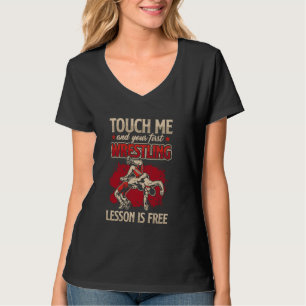 Camiseta Tócame y tu primera lección de lucha libre es grat