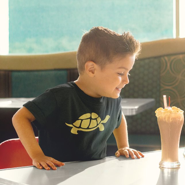 Camiseta Tortuga dorada (Boy smiling at ice-cream milk shake while wearing yellow tortise cartoon design)