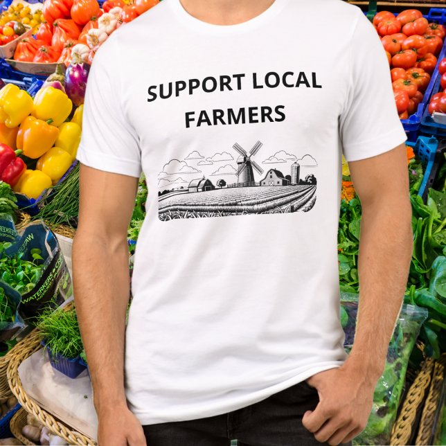 Camiseta Triblenda Apoyo a los agricultores locales cultivadores de p (A t-shirt with 'Support Local Farmers' caption and line art arable farm picture with windmill)