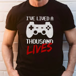 Camiseta Triblenda He vivido mil videojuegos<br><div class="desc">Muestra tu amor por los juegos con la camiseta "He vivido mil vidas videojuegos". Esta camisa presenta un diseño audaz con un controlador de juegos y una declaración sorprendente, perfecta para cualquier jugador ávido. Fabricado con materiales de alta calidad, esta camiseta garantiza comodidad y durabilidad para las sesiones de juego...</div>