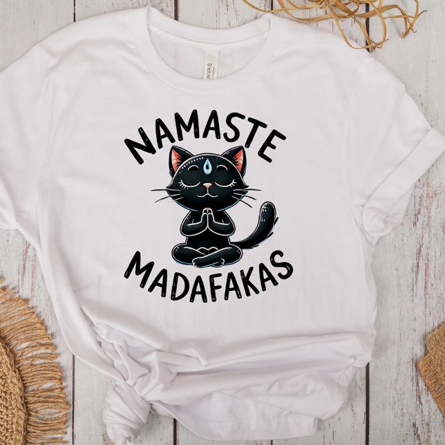 Camiseta Triblenda "Namaste Madafakas", curiosos amantes de un gato ("Namaste Madafakas" Funny Cat Lovers Tri-Blend Shirt on a desk with boho decoration)