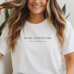 Camiseta Triblenda Ropa de Novia Prometida con Guión Moderno Personal<br><div class="desc">Entre en su era de compromiso con esta camiseta de novia con guión moderno personalizado que captura la emoción de este capítulo inolvidable. Ya sea que esté planeando fiestas, eligiendo colores o simplemente disfrutando del momento, esta suave camiseta triblend es perfecta para absorberlo todo con facilidad y confianza. ¡Una elección...</div>