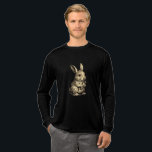 Camiseta Triblenda Rustic Rabbit<br><div class="desc">Embrace the charm of the countryside with this beautifully detailed sketch of a bunny enjoying a carrot. With a vintage,  hand-drawn aesthetic and soft sepia tones,  this design brings a touch of rustic warmth to your wardrobe. Perfect for gardeners,  nature lovers,  or anyone who appreciates classic animal illustrations.</div>