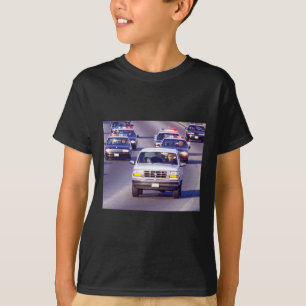 Camiseta Trump y gordo Vance persecución en coche de policí