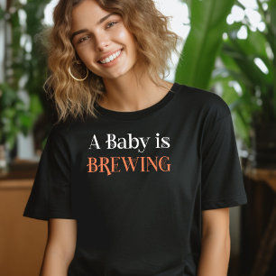 Camiseta Un bebé se está gestando en letra de telaraña espe