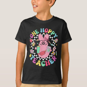Camiseta Un conejo maestro saltarín día de Pascua huevos di