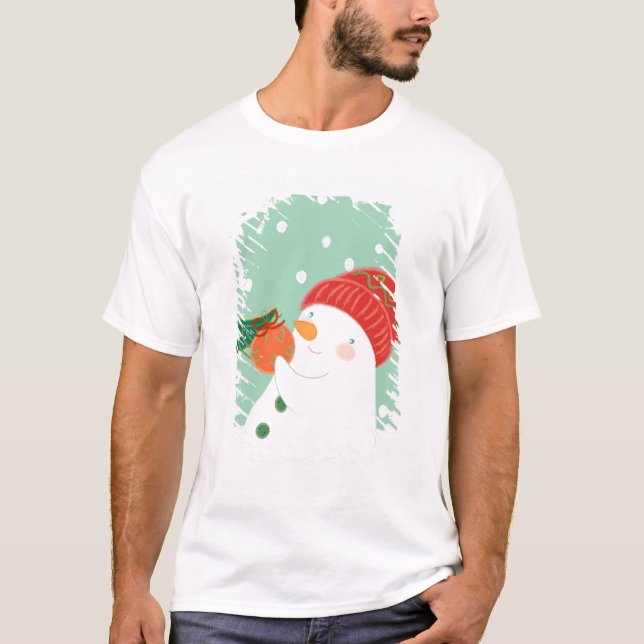 Camiseta Un muñeco de nieve que cuelga un ornamento en un (Anverso)