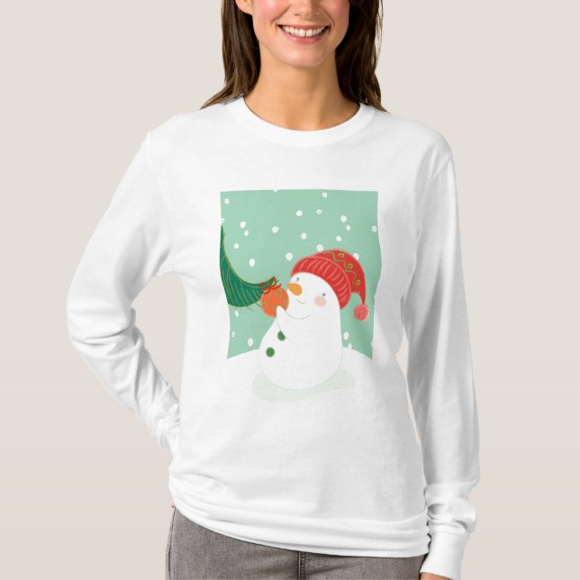 Camiseta Un muñeco de nieve que cuelga un ornamento en un (Anverso)