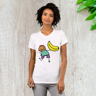 Camiseta Un niño juguetón sostiene un gran plátano amarillo