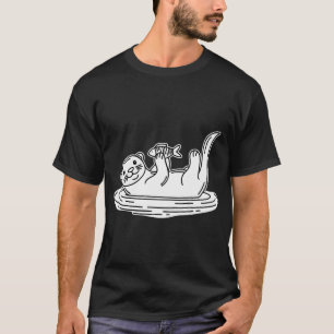 Camiseta Una nutria flotando de espaldas mientras sostiene