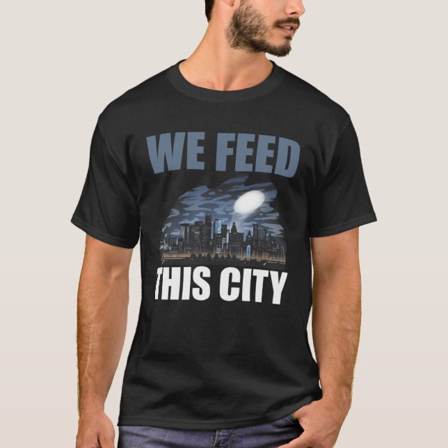 Camiseta We Feed This City Food Restaurant Cafeteria (Anverso)